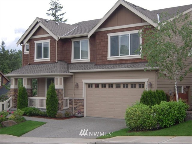 1614 Lyons Place Northeast Renton, WA 98059 - Photo 1 of 1 a view of a house with a yard and plants