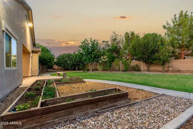 a view of a backyard with sitting area