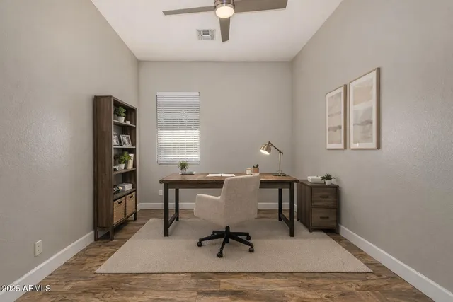 a workspace with furniture hardwood and a window