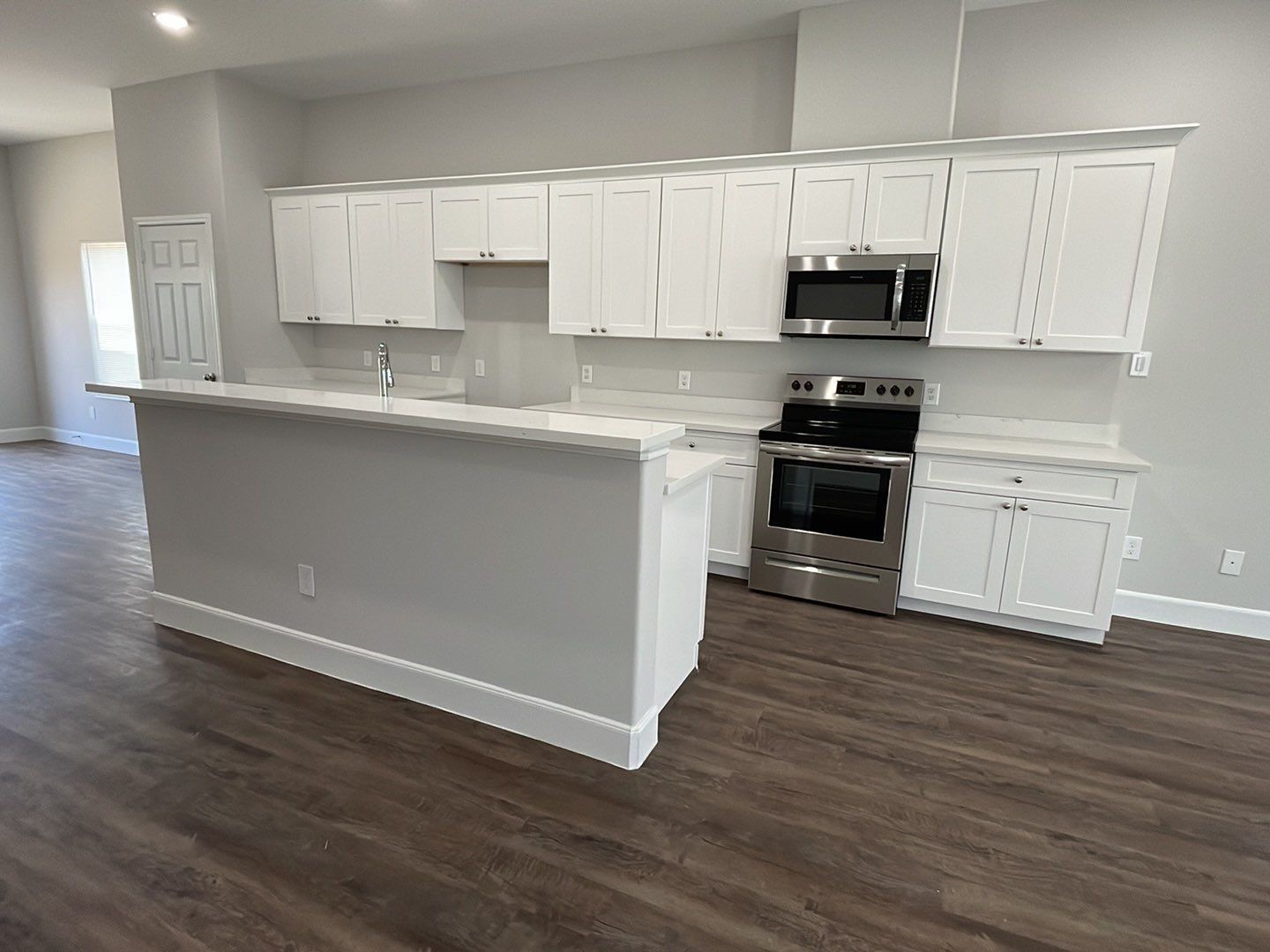 798 County Road 5702 Cleveland, TX 77327 - Photo 12 of 25 a kitchen with stainless steel appliances granite countertop a stove a sink and white cabinets