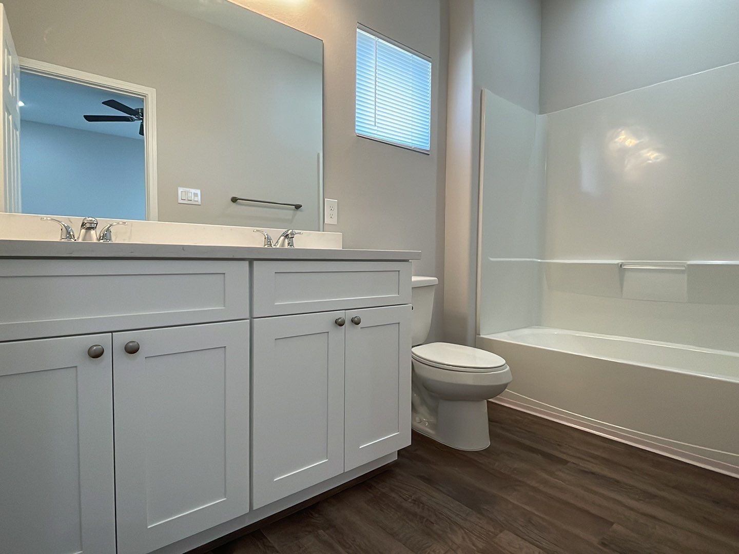798 County Road 5702 Cleveland, TX 77327 - Photo 19 of 25 a bathroom with a toilet a sink and bathtub