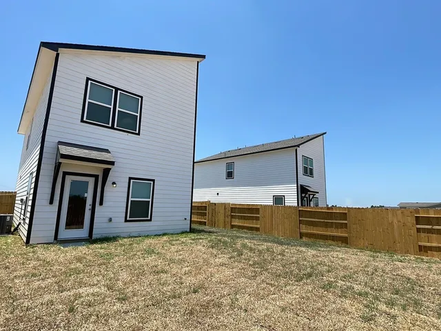 a house view with a backyard space