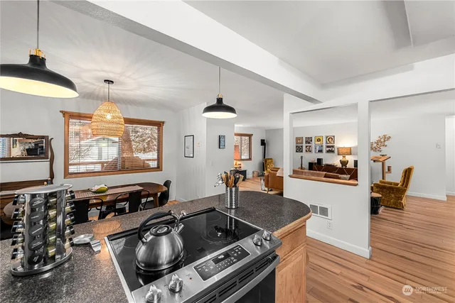 a bedroom with a bed and a wall painting