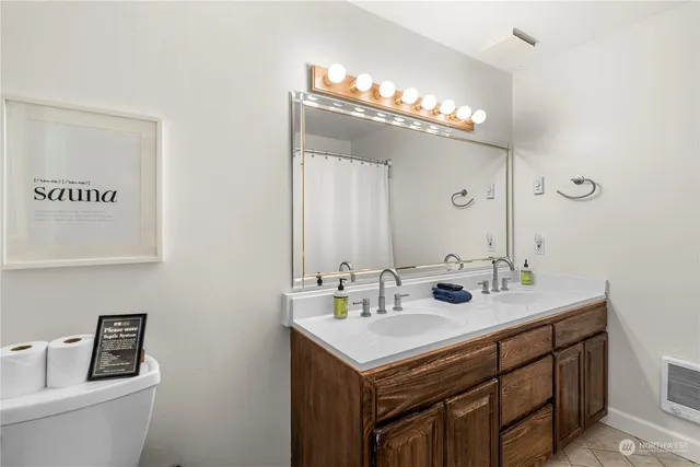 a bedroom with double bunk beds and window