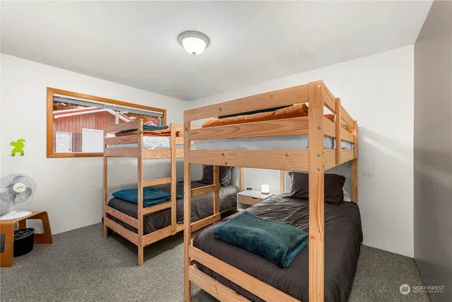 a view of a house with wooden wall and roof