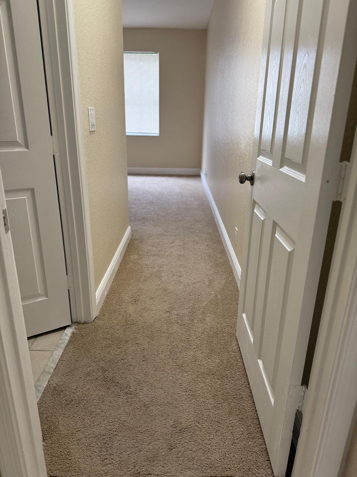 3569 Forest Hill Boulevard, Unit 110 Palm Springs, FL 33406 - Photo 14 of 23 an entryway door with a hallway in a house