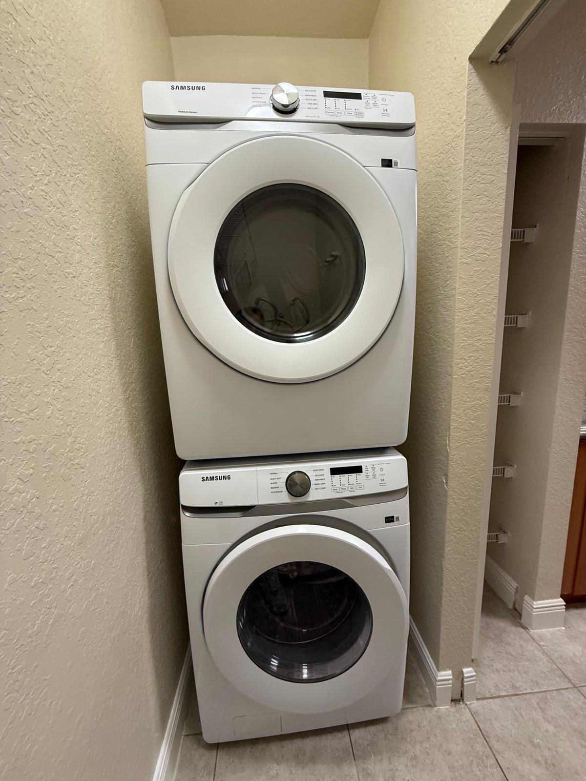 3569 Forest Hill Boulevard, Unit 110 Palm Springs, FL 33406 - Photo 22 of 23 a utility room with dryer and washer