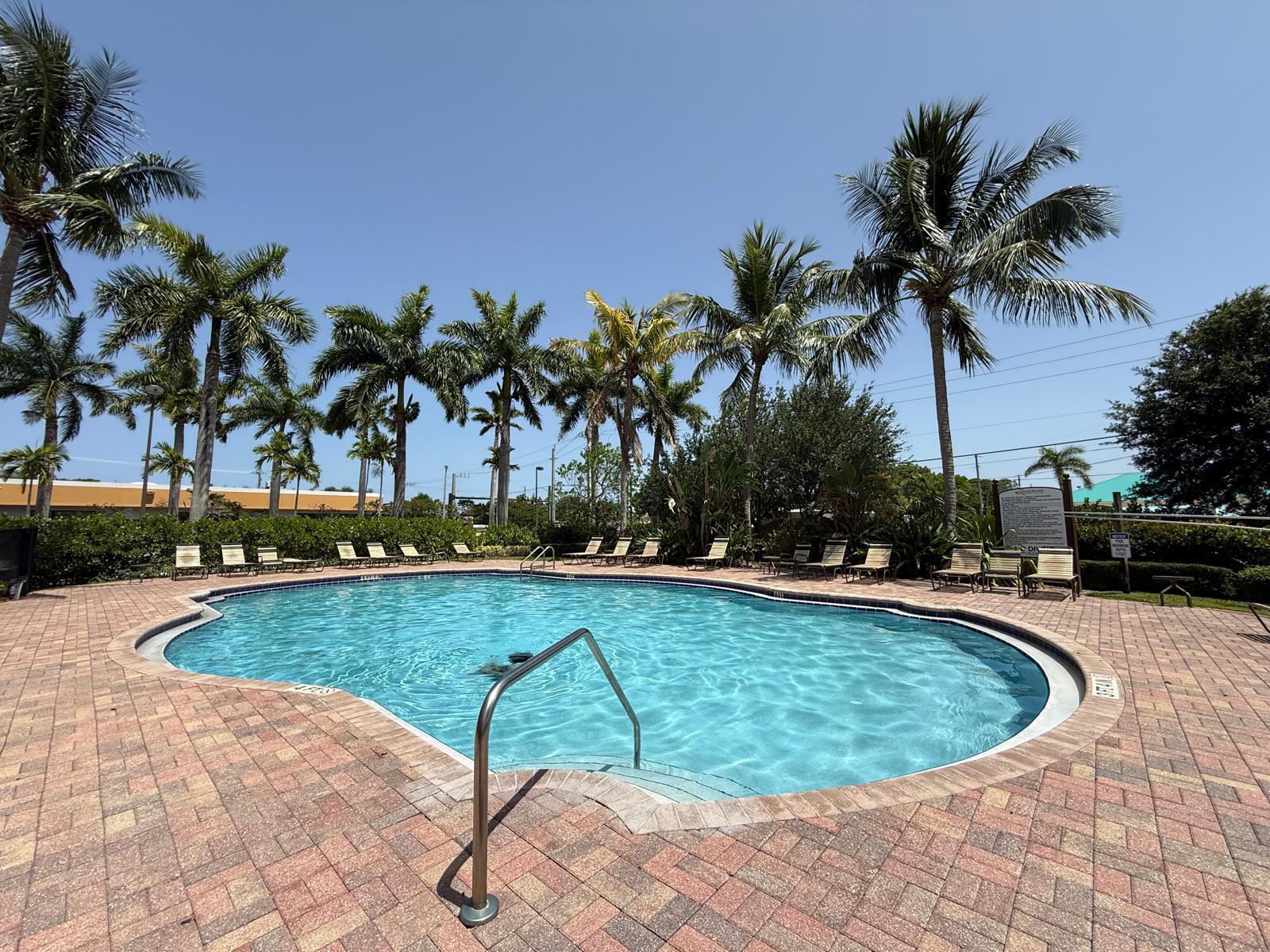 3569 Forest Hill Boulevard, Unit 110 Palm Springs, FL 33406 - Photo 23 of 23 a view of swimming pool with seating space