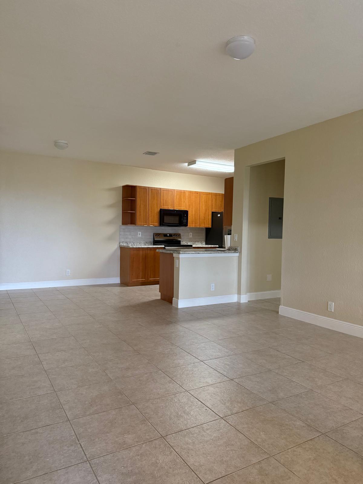 3569 Forest Hill Boulevard, Unit 110 Palm Springs, FL 33406 - Photo 9 of 23 a view of a kitchen with a sink