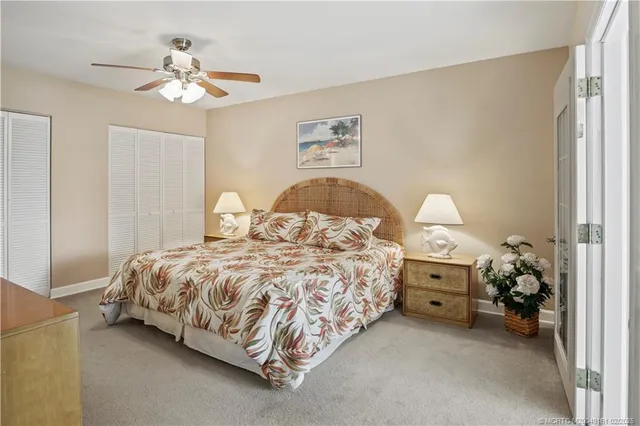 a spacious bedroom with a large bed and a large window