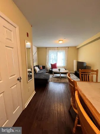 a view of a living room and dining room