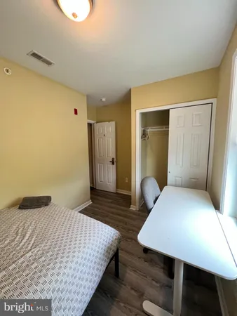 a bedroom with a bed and a table in it