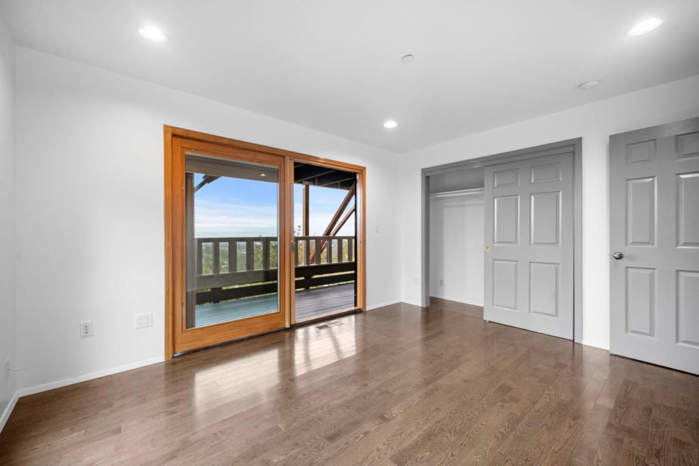 15 Anson Road, Unit B Hillsborough, CA 94010 - Photo 20 of 25 a view of an empty room with wooden floor and a window