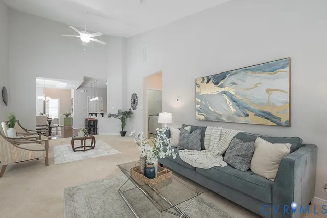 a living room with furniture and a painting