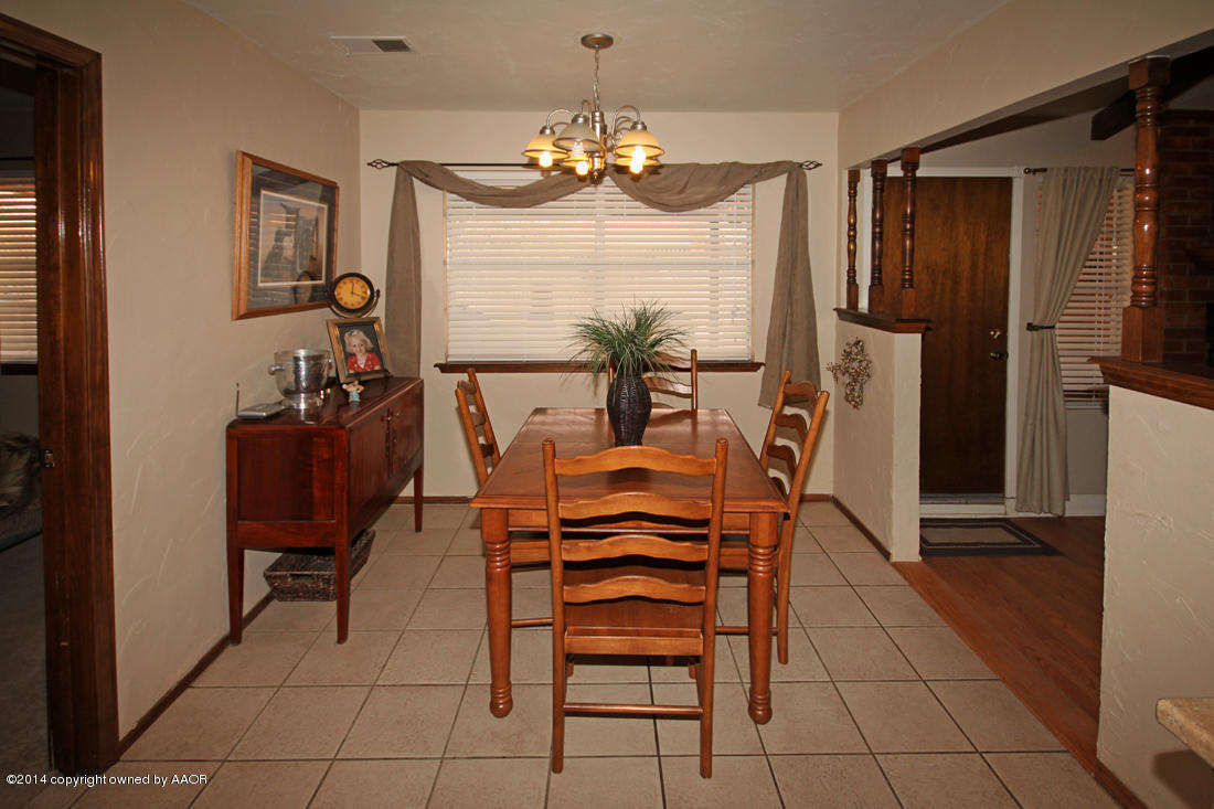 5320 Wheeler Lane Amarillo, TX 79110 - Photo 6 of 23 a view of a dining room with furniture and chandelier