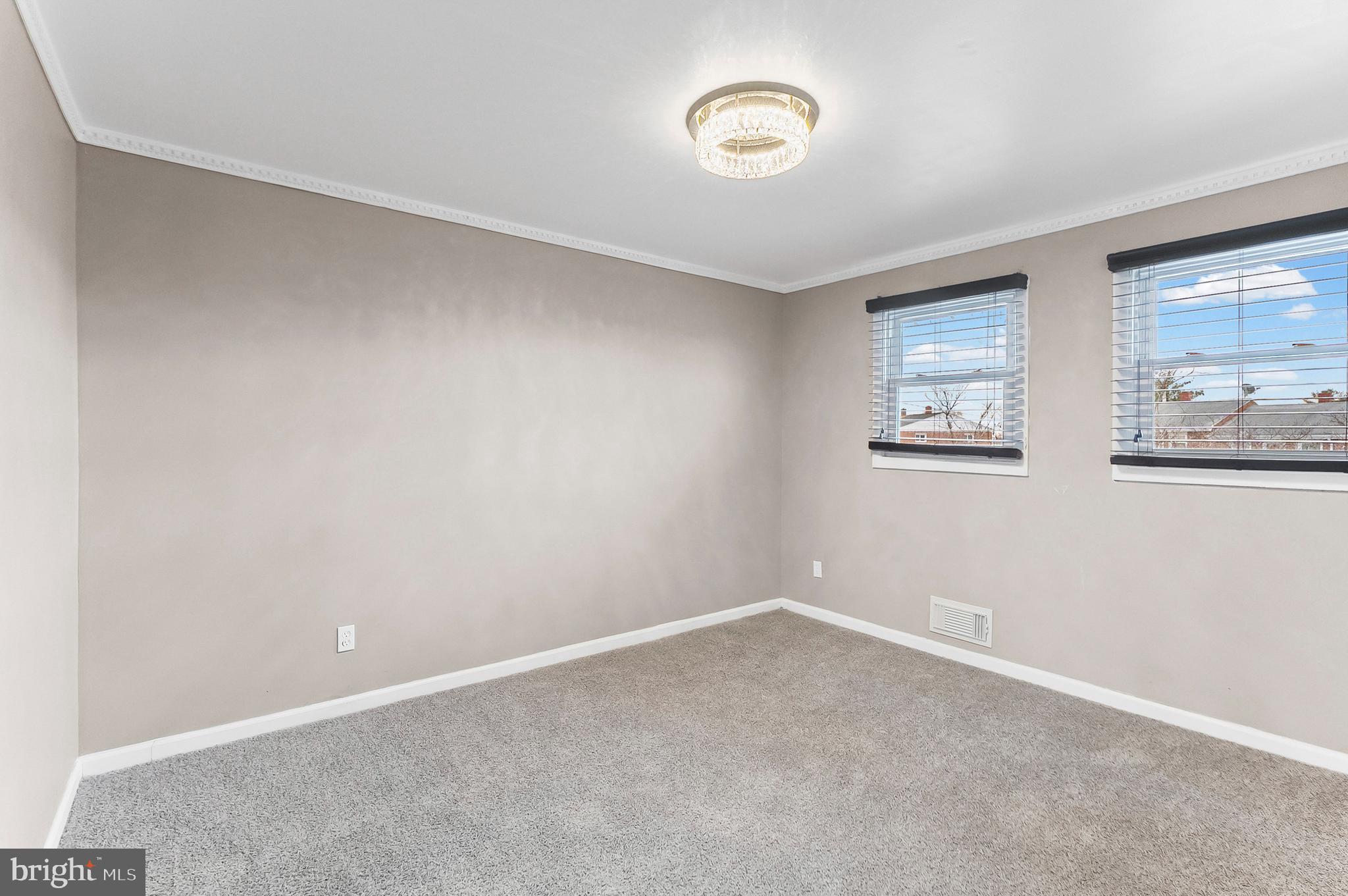 6955 Blanche Road Baltimore, MD 21215 - Photo 14 of 26 an empty room with a window