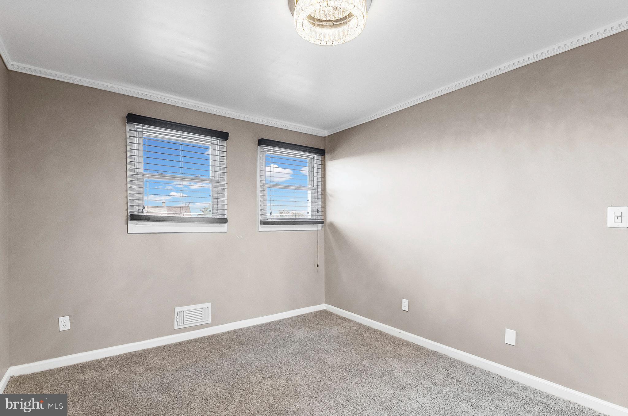 6955 Blanche Road Baltimore, MD 21215 - Photo 16 of 26 an empty room with windows
