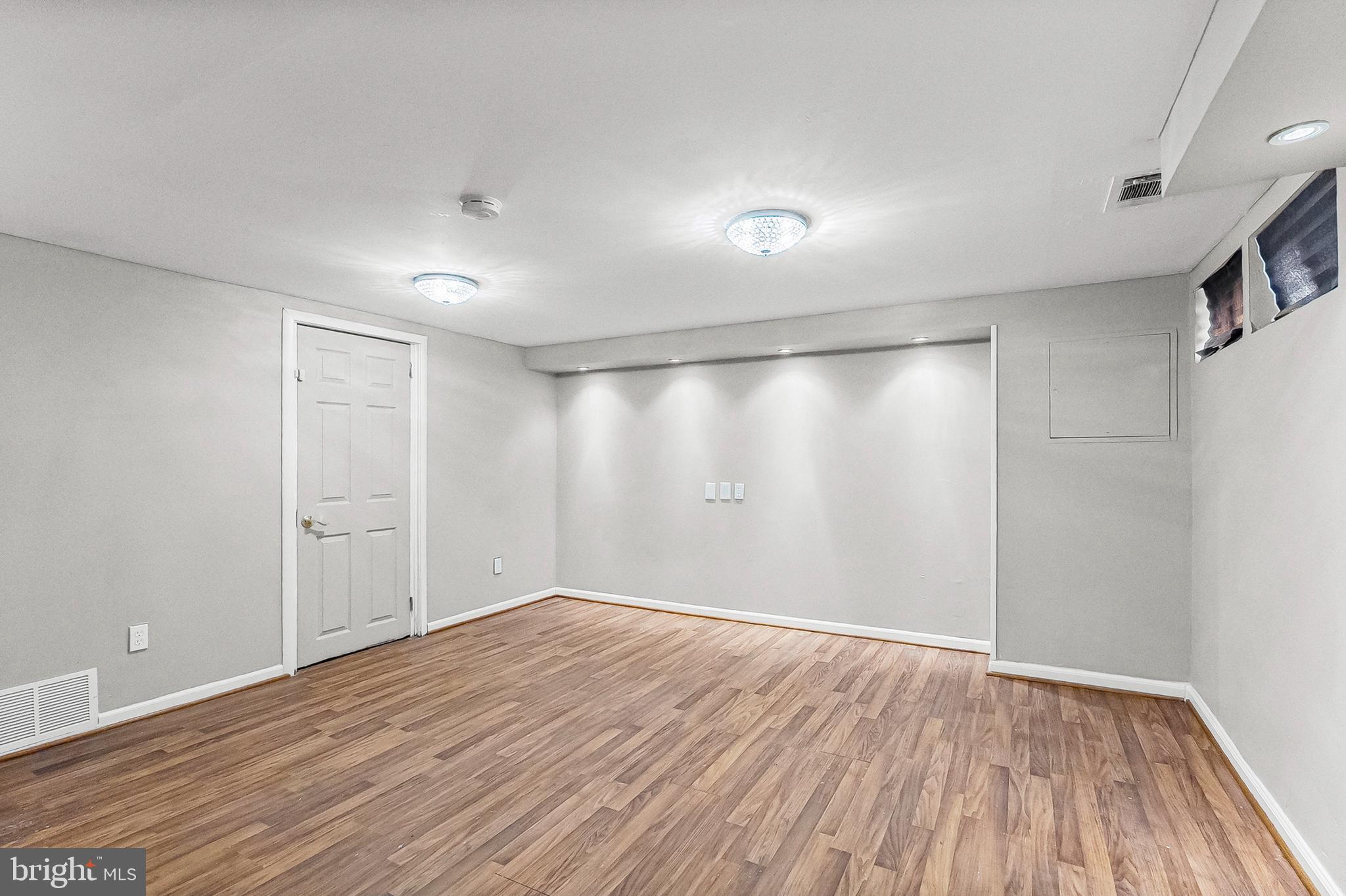 6955 Blanche Road Baltimore, MD 21215 - Photo 20 of 26 a view of an empty room with wooden floor