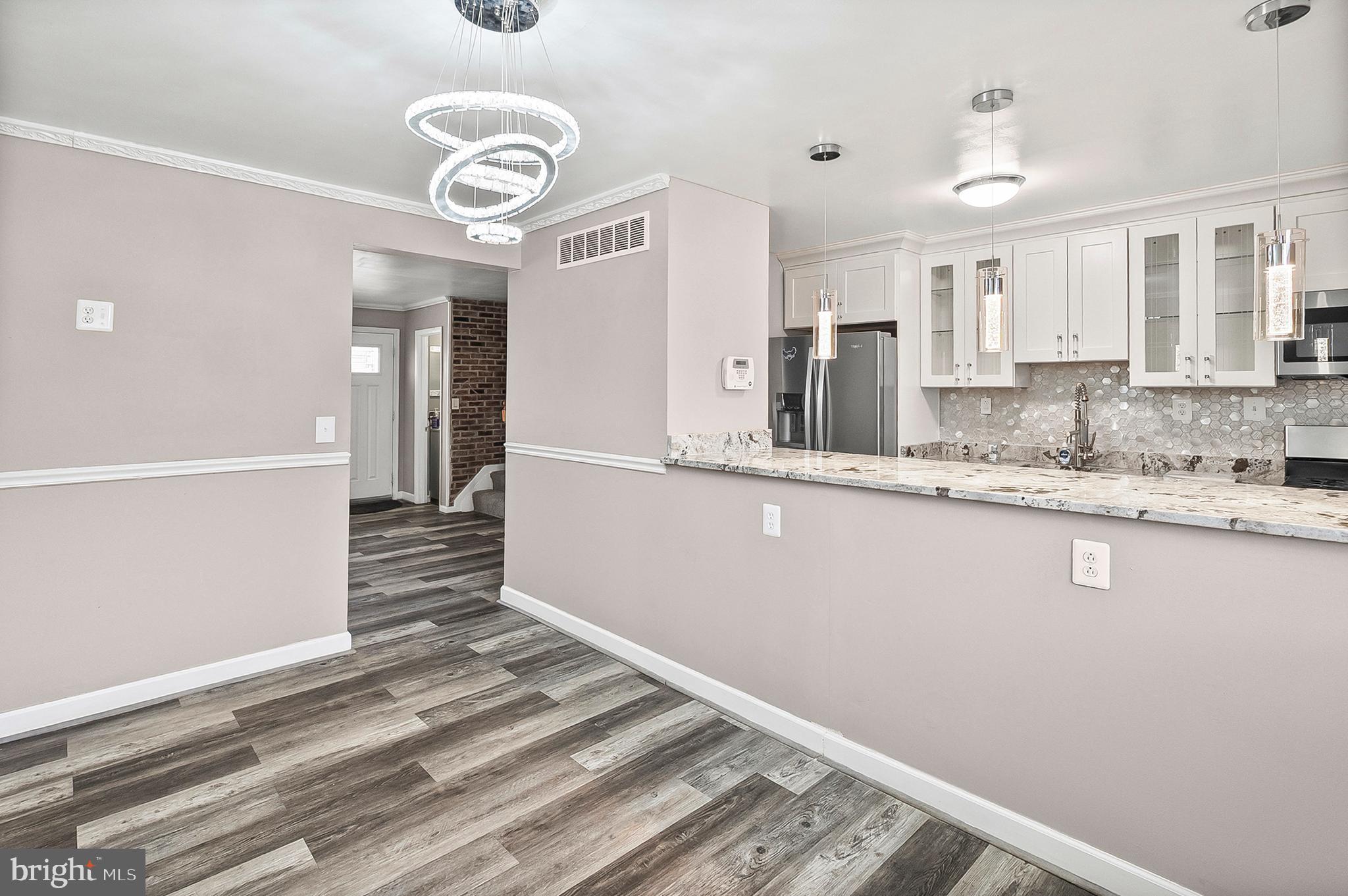 6955 Blanche Road Baltimore, MD 21215 - Photo 8 of 26 a view of a kitchen from the hallway