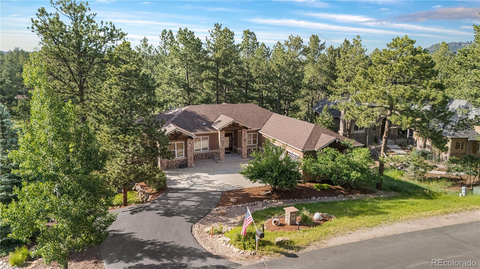 691 Cumberland Road Larkspur, CO 80118 - Photo 1 of 43 an aerial view of a house