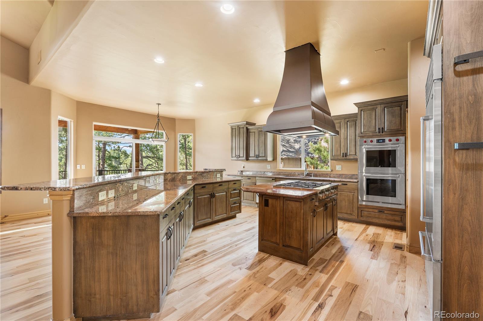 691 Cumberland Road Larkspur, CO 80118 - Photo 11 of 43 a kitchen with a stove and a refrigerator