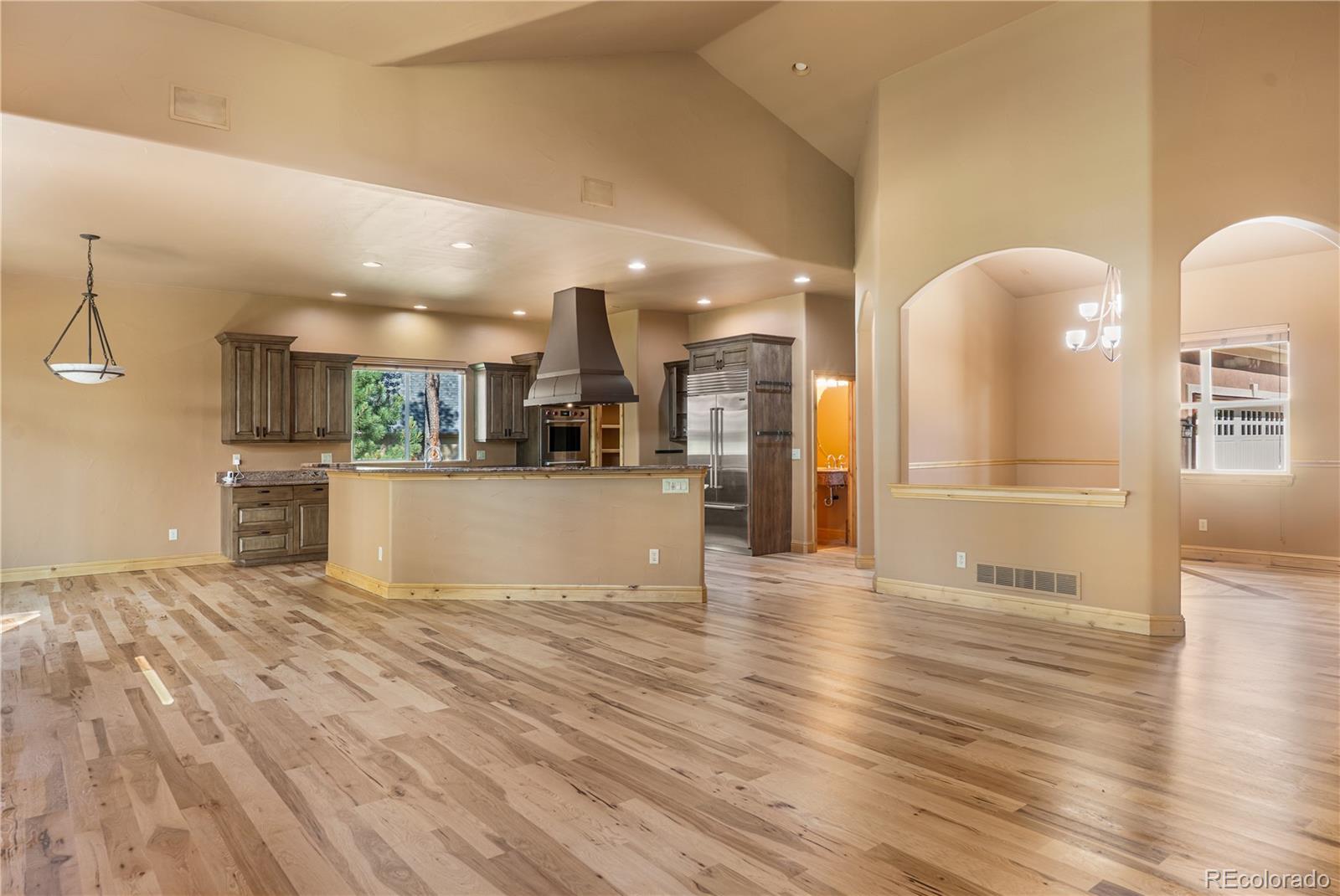 691 Cumberland Road Larkspur, CO 80118 - Photo 6 of 43 a view of a kitchen with cabinets and wooden floor