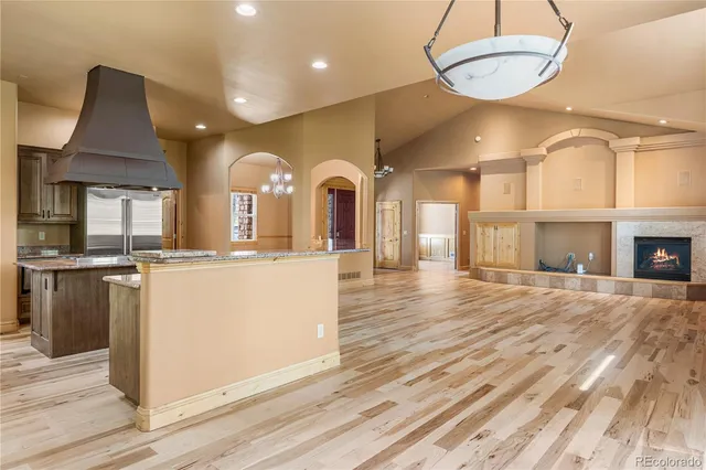 a view of a kitchen with furniture and a fireplace