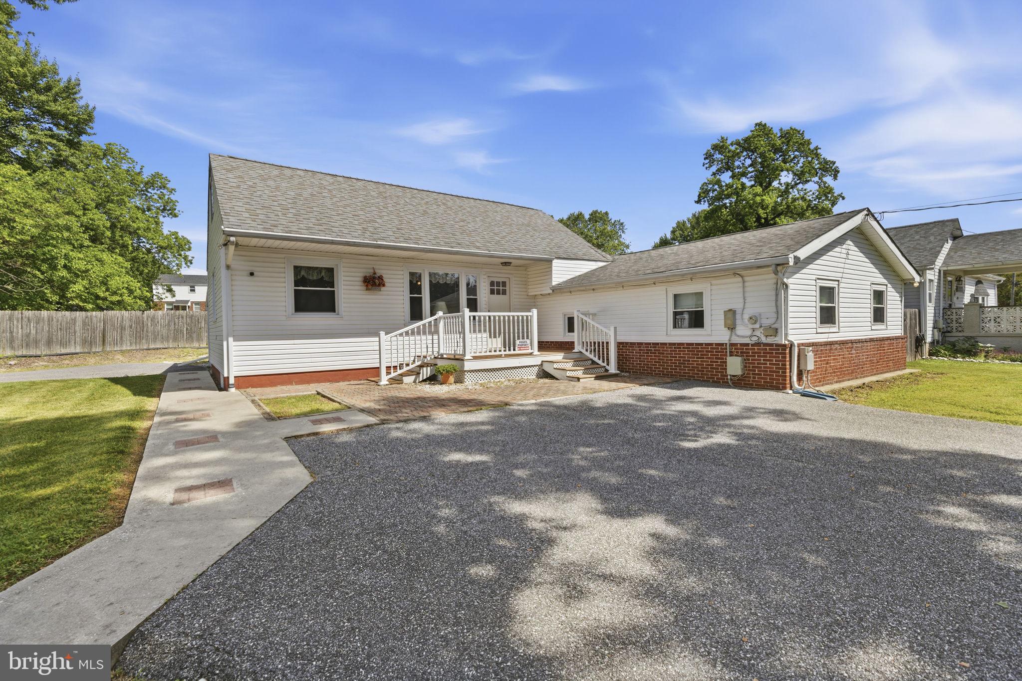2411 Poplar Road Baltimore, MD 21221 - Photo 1 of 36 a front view of a house with garden