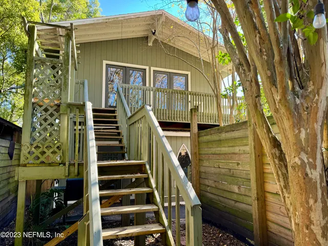 a front view of a house with wooden stairs