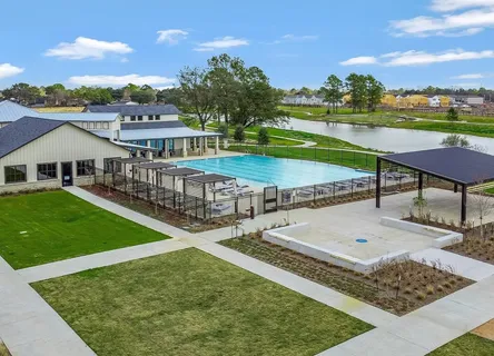 an aerial view of a house having swimming pool having patio