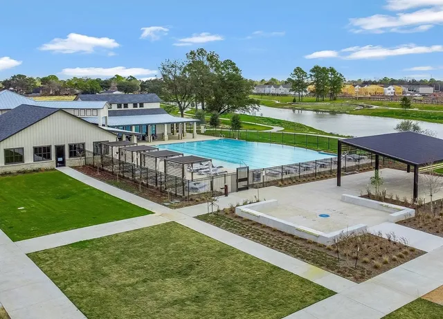 an aerial view of a house having swimming pool having patio
