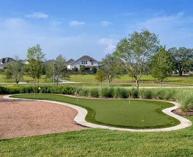 a view of a golf course with a lake view