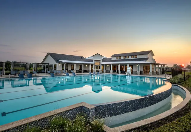 a front view of a house with a yard table and chairs