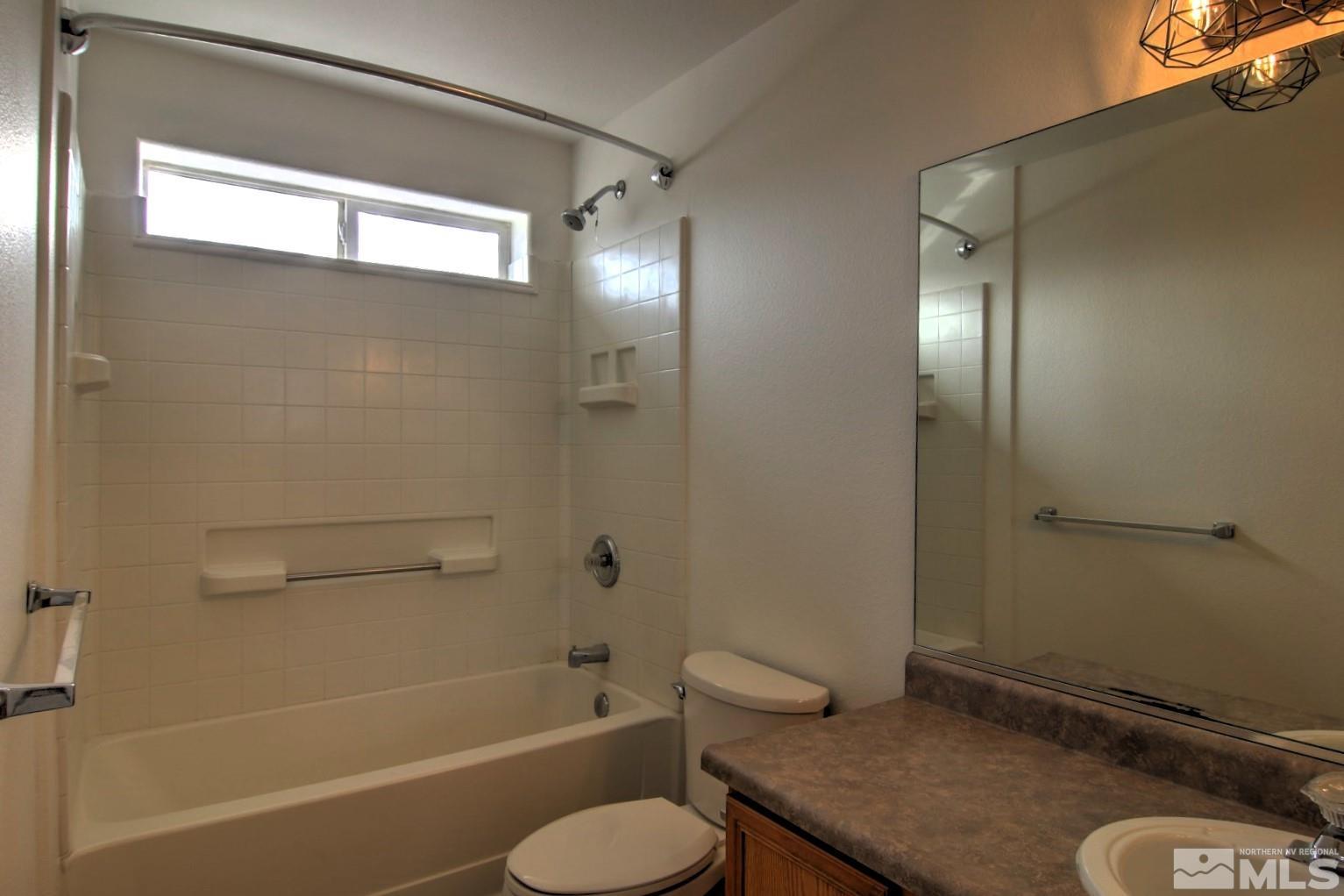 433 Holcomb Avenue Reno, NV 89502 - Photo 17 of 31 a bathroom with a sink toilet and shower