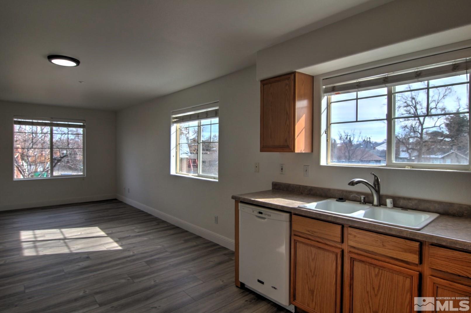 433 Holcomb Avenue Reno, NV 89502 - Photo 2 of 31 a kitchen with a sink window and cabinets