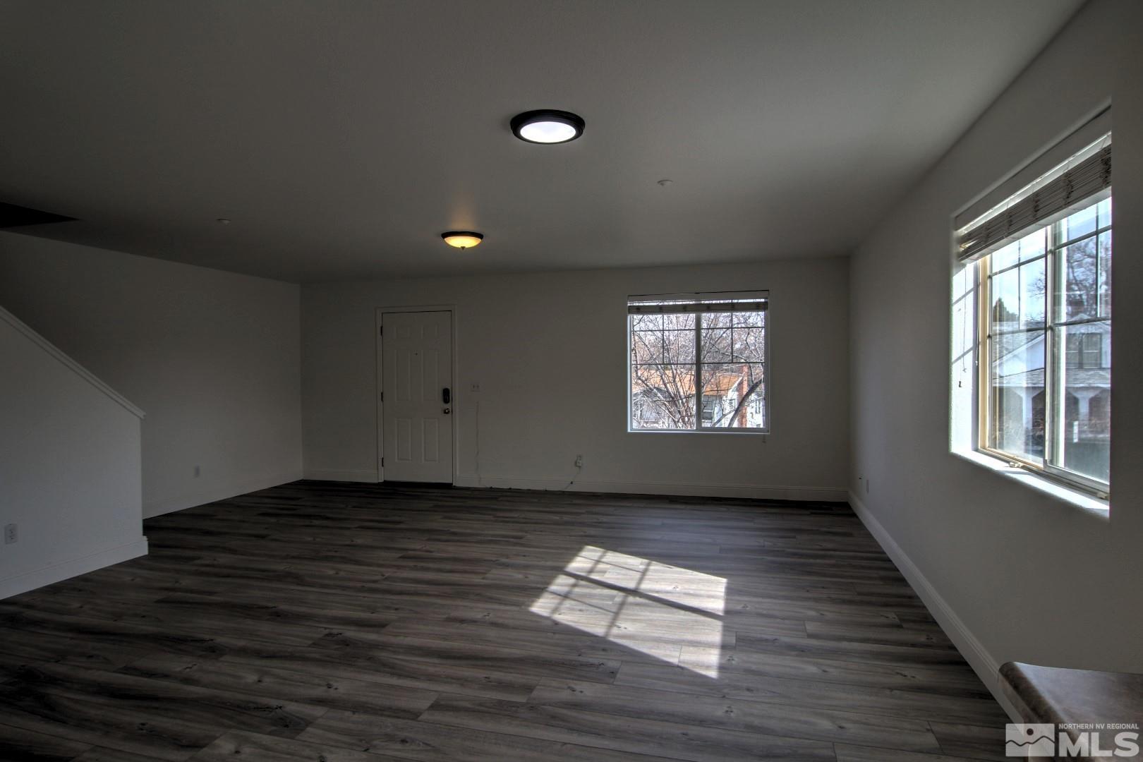 433 Holcomb Avenue Reno, NV 89502 - Photo 5 of 31 a view of empty room with wooden floor and fan