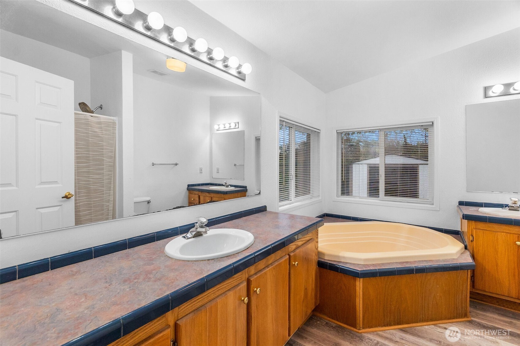 71 East Rhododendron Place Shelton, WA 98584 - Photo 17 of 38 a bathroom with a sink a tub and mirror