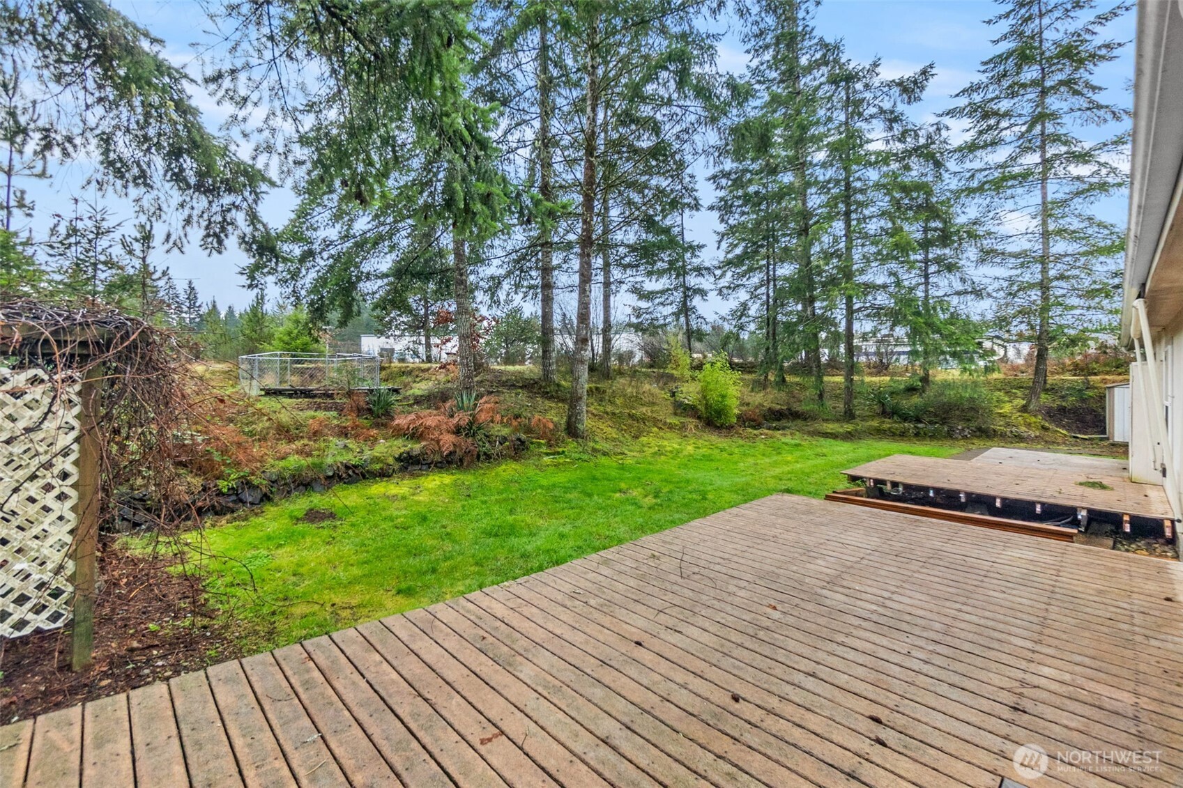 71 East Rhododendron Place Shelton, WA 98584 - Photo 32 of 38 a view of a backyard with wooden floor