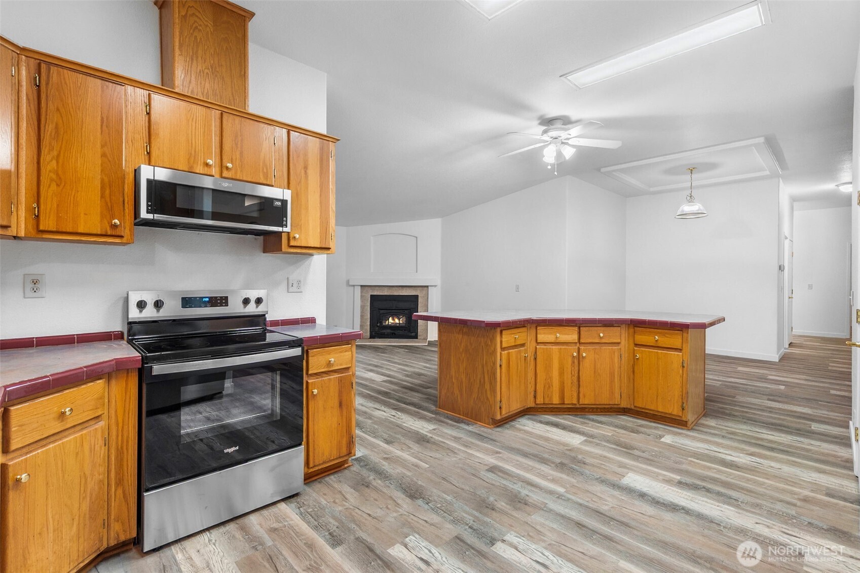 71 East Rhododendron Place Shelton, WA 98584 - Photo 10 of 38 a kitchen with stainless steel appliances granite countertop a stove a sink and a microwave