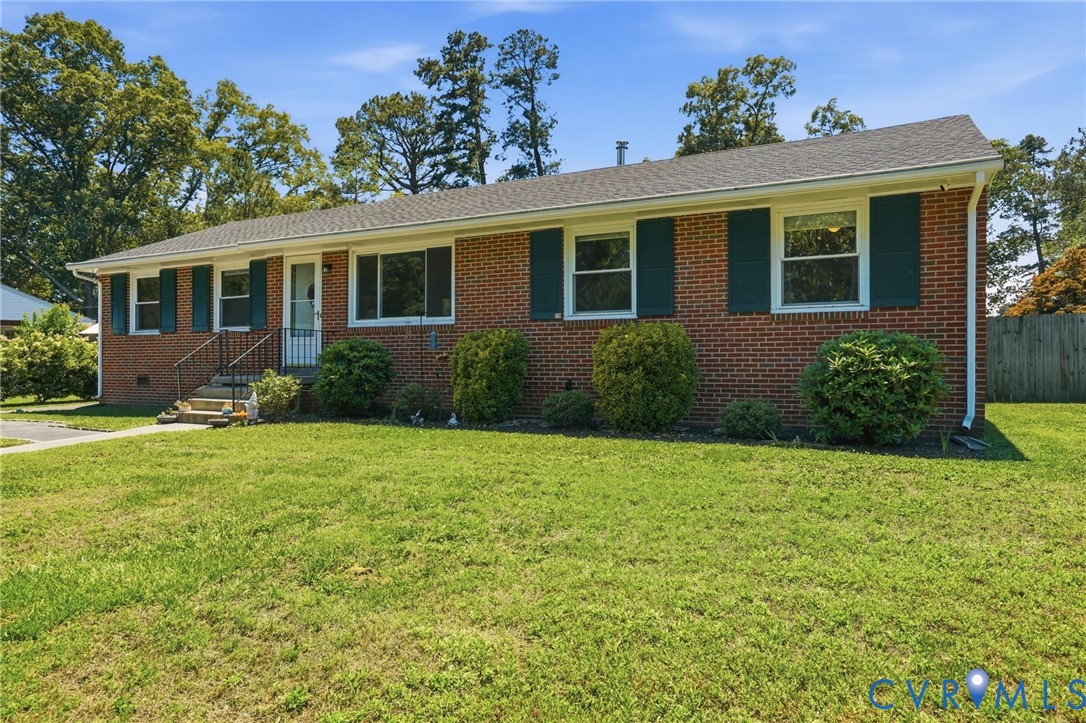 2403 Omega Road Henrico, VA 23228 - Photo 3 of 39 a front view of a house with garden