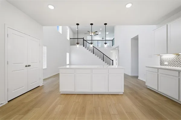 a view of kitchen with furniture and wooden floor