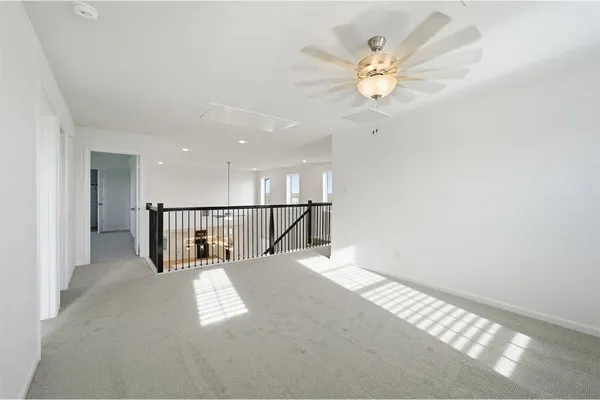 a view of entryway and hall with a window