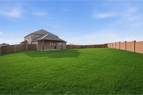 a view of a house with a big yard