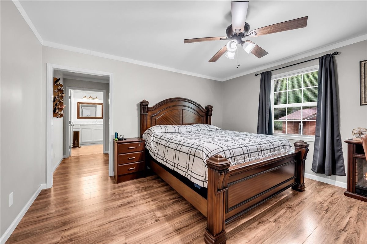 802 Meyers Road Altamont, TN 37301 - Photo 6 of 30 a bedroom with a bed and a chandelier