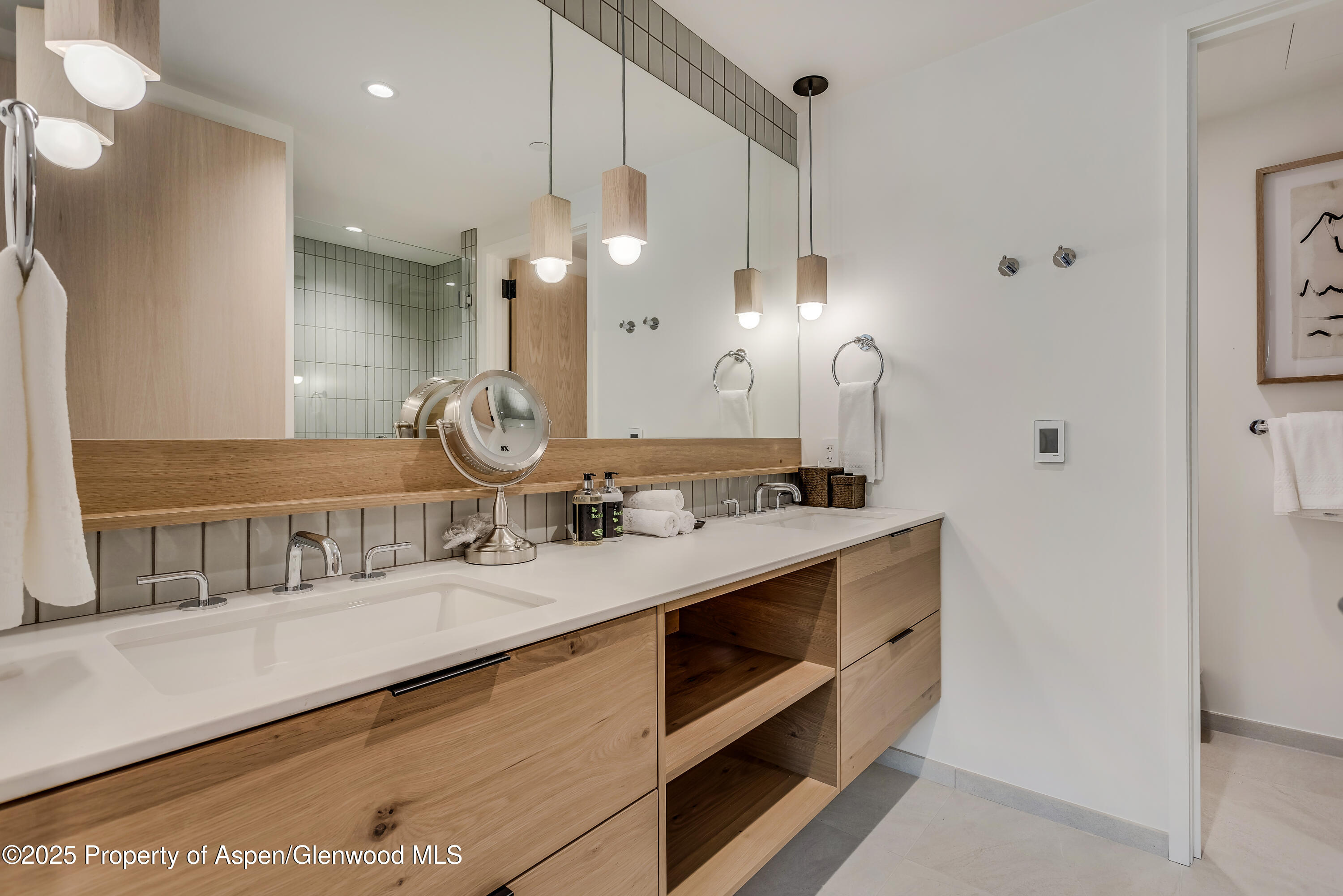 119 Wood Road, Unit 103 Snowmass Village, CO 81615 - Photo 12 of 23 a bathroom with a sink a vanity and a large mirror