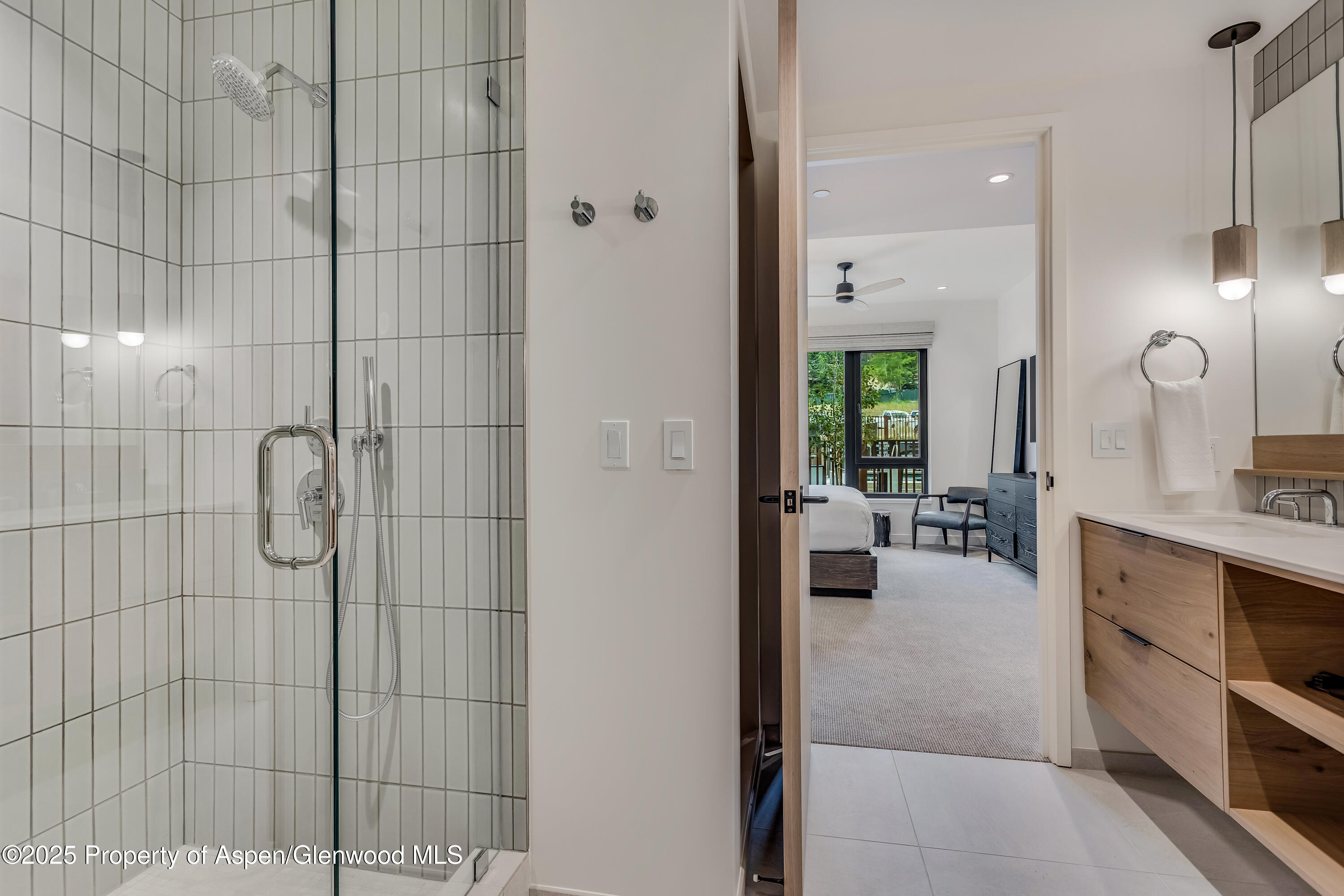 119 Wood Road, Unit 103 Snowmass Village, CO 81615 - Photo 13 of 23 a bathroom with a sink double vanity and shower