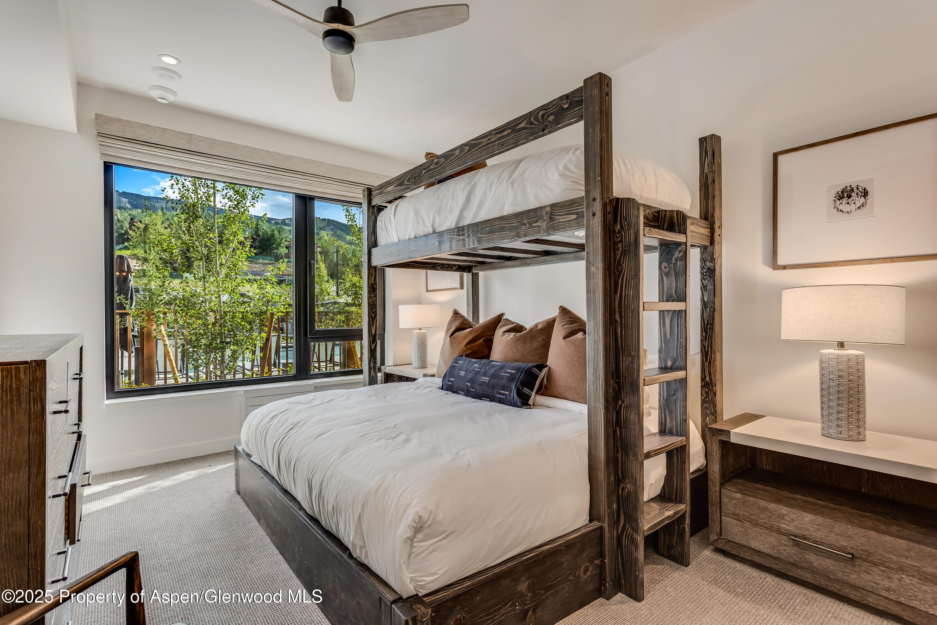 119 Wood Road, Unit 103 Snowmass Village, CO 81615 - Photo 14 of 23 a bedroom with a bed and a window