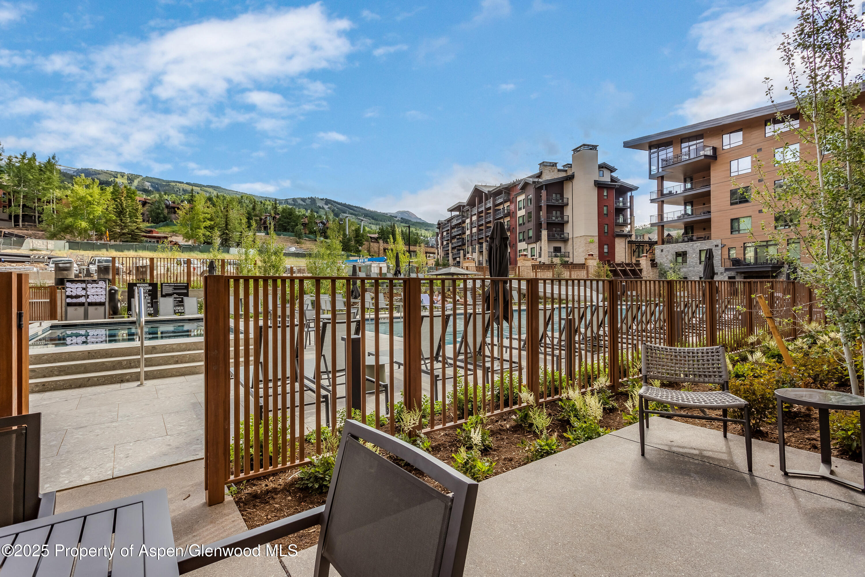 119 Wood Road, Unit 103 Snowmass Village, CO 81615 - Photo 21 of 23 a view of a chairs and table in the balcony