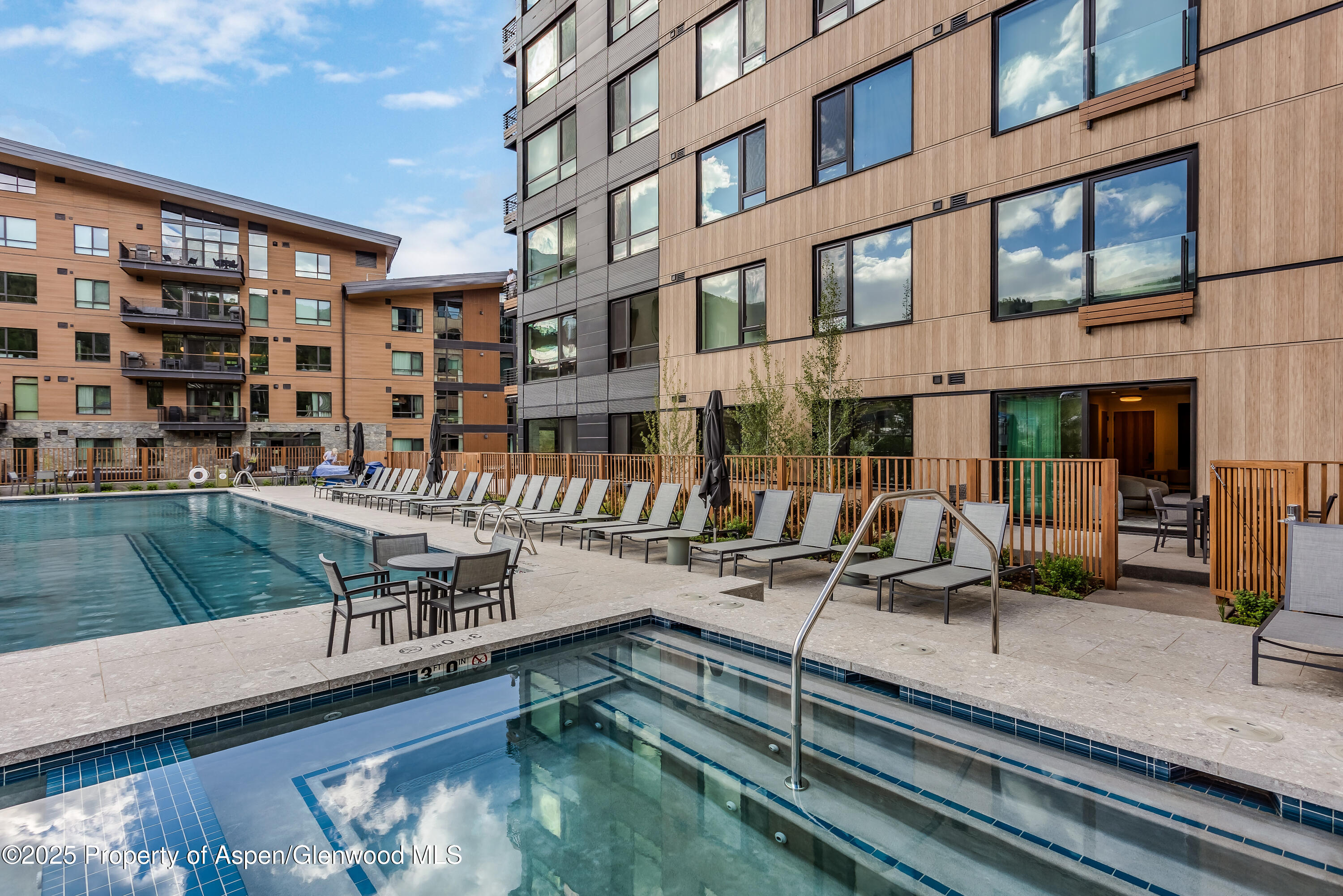 119 Wood Road, Unit 103 Snowmass Village, CO 81615 - Photo 22 of 23 a view of building with outdoor seating