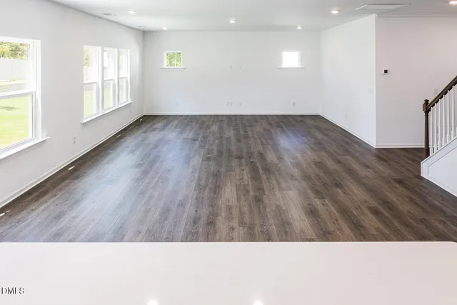 a view of kitchen with wooden floor and electronic appliances